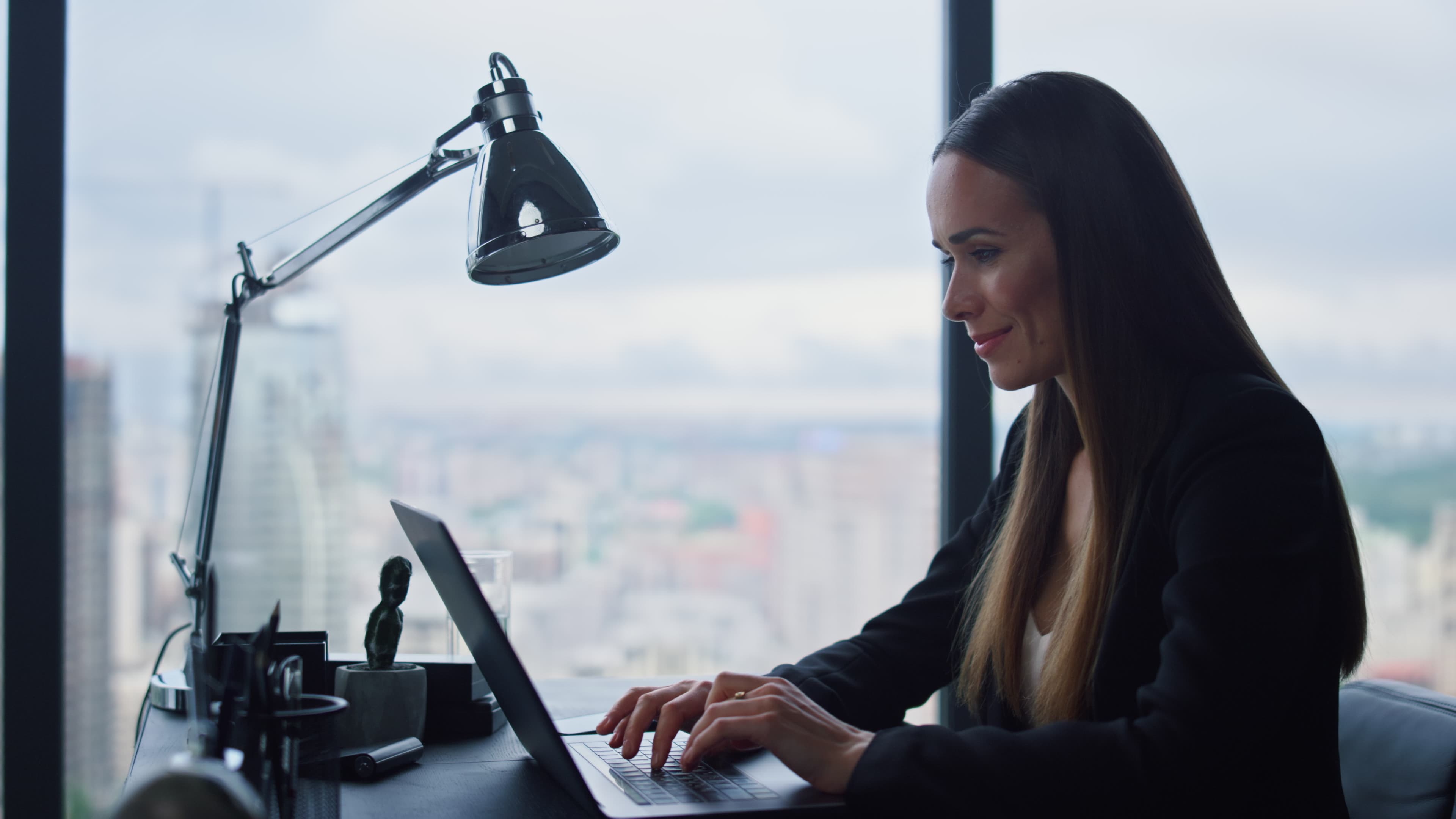 Businesswoman Smiling Using Computer