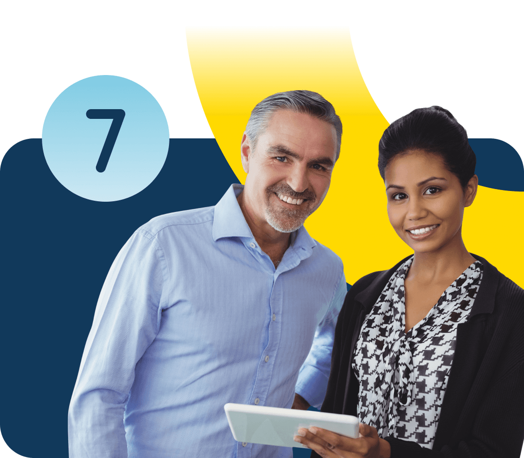 A man and a woman holding an iPad smile directly at the camera with the number seven in a light blue circle floats near the man's head.