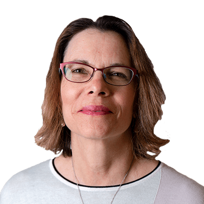 A woman wearing glasses and a white shirt smiles at the camera. 