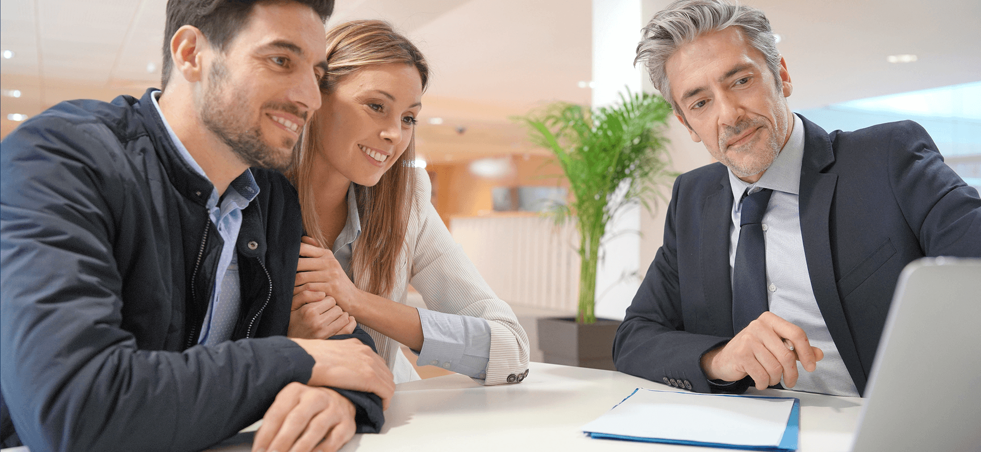 A couple reviewing mortgage documents