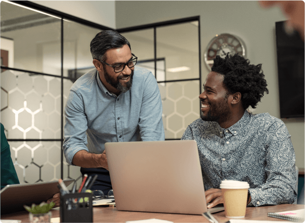Two colleagues discussing financials