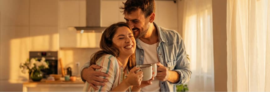 A group of banking professionals attend a meeting or presentation with laptops, collaborating on mortgage lending operations